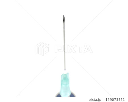 a syringe on a white background a syringe on a white background 139073551