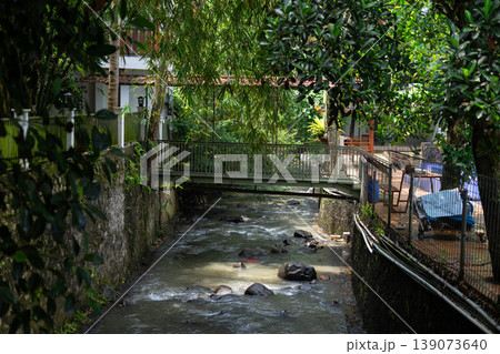 Urban Canal with Bridge and Natural Shade from Trees Urban Canal with Bridge and Natural Shade from Trees 139073640