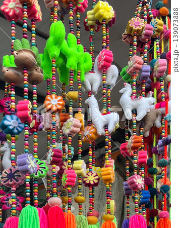 Purmamarca market in Jujuy, Argentina .Garlands of handmade coloured pompoms 139073888