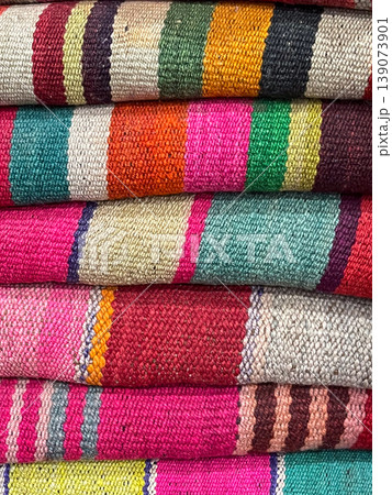 Colourful aboriginal weavings in Tilcara, Argentina.Weavings on the loom Colourful aboriginal weavings in Tilcara, Argentina.Weavings on the loom 139073901