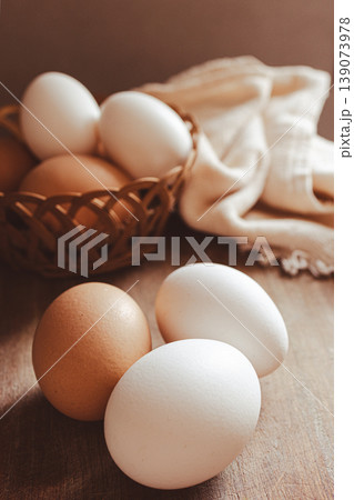Farm fresh, brown and white organic eggs resting representing healthy nutrition, sustainable food, and protein for breakfast Farm fresh, brown and white organic eggs resting representing healthy nutrition, sustainable food, and protein for breakfast 139073978