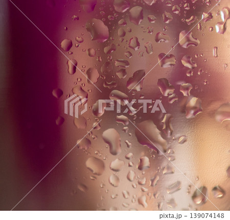 Pink background with water drops and light reflections. Space for text. Abstract wallpaper 139074148