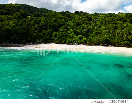 Aerial flying drone view seashore waves water surface texture in sunny tropical ocean at Phuket island Thailand Aerial flying drone view seashore waves water surface texture in sunny tropical ocean at Phuket island Thailand 139074914