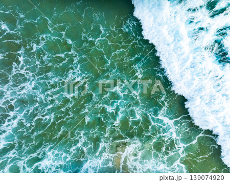 Beautiful wave crashing on sandy shore at beach in phuket thailand Beautiful wave crashing on sandy shore at beach in phuket thailand 139074920