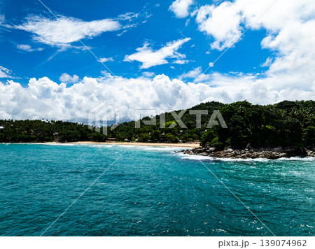 Aerial flying drone view seashore waves water surface texture in sunny tropical ocean at Phuket island Thailand 139074962