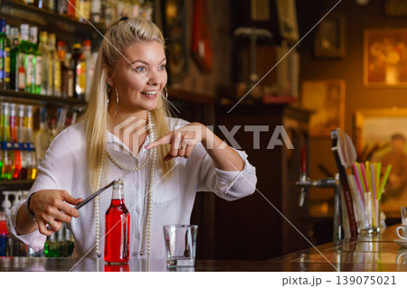 Woman working at the bar counter 139075021