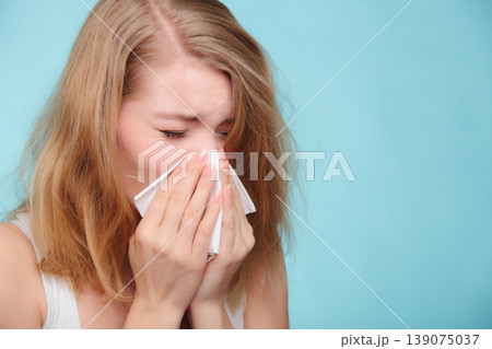 Flu allergy. Sick girl sneezing in tissue. Health Flu allergy. Sick girl sneezing in tissue. Health 139075037