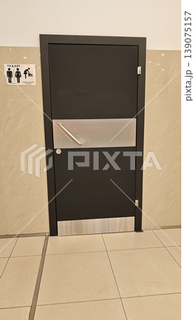 Door leading to restroom with clear signage indicating gender at a public place Door leading to restroom with clear signage indicating gender at a public place 139075157