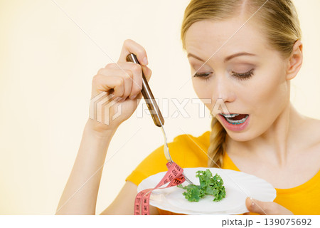 Shocked young woman being on diet Shocked young woman being on diet 139075692