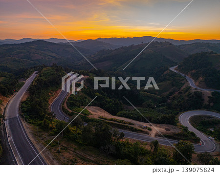 Aerial view of Sunset Light Dancing on Nan Winding Highland Road Aerial view of Sunset Light Dancing on Nan Winding Highland Road 139075824