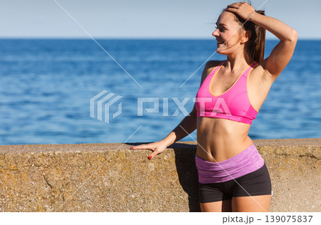 Woman resting relaxing after doing sports outdoors Woman resting relaxing after doing sports outdoors 139075837