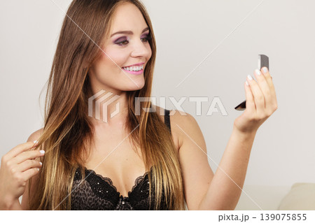 Woman attractive girl looking in mirror 139075855
