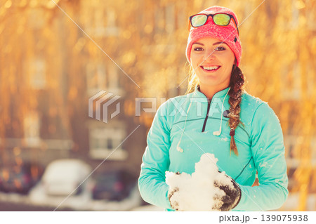 Girl with snow in city. Girl with snow in city. 139075938