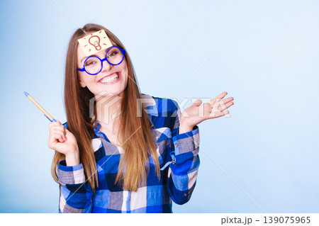 woman thinking light idea bulb on head, creative girl lots of ideas 139075965