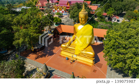 Aerial view of Sacred Relic Temple Wat Phra That Pu Jae on the Mountain Peak Aerial view of Sacred Relic Temple Wat Phra That Pu Jae on the Mountain Peak 139075987