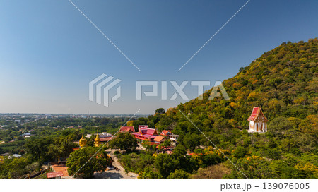 Aerial view of close up big Buddha on the hill of Wat Phra That Pu Jae in Phrae Aerial view of close up big Buddha on the hill of Wat Phra That Pu Jae in Phrae 139076005