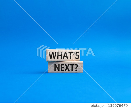 What is next symbol. Concept words What is next on wooden blocks. Beautiful blue background. Business and What is next concept. Copy space. 139076479