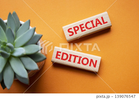 SPECIAL EDITION symbol. Concept word SPECIAL EDITION on wooden blocks. Beautiful orange background with succulent plant. Business and SPECIAL EDITION concept. Copy space 139076547