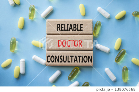 Reliable doctor consultation symbol. Concept words Reliable doctor consultation on wooden blocks. Beautiful blue background with pills. Healthcare and Reliable doctor consultation concept. Copy space. Reliable doctor consultation symbol. Concept words Reliable doctor consultation on wooden blocks. Beautiful blue background with pills. Healthcare and Reliable doctor consultation concept. Copy space. 139076569
