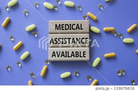 MEDICAL ASSISTANCE AVAILABLE symbol. Concept words MEDICAL ASSISTANCE AVAILABLE on wooden blocks. Beautiful purple background with pills. Healthcare and MEDICAL ASSISTANCE AVAILABLE concept. Copy MEDICAL ASSISTANCE AVAILABLE symbol. Concept words MEDICAL ASSISTANCE AVAILABLE on wooden blocks. Beautiful purple background with pills. Healthcare and MEDICAL ASSISTANCE AVAILABLE concept. Copy 139076616