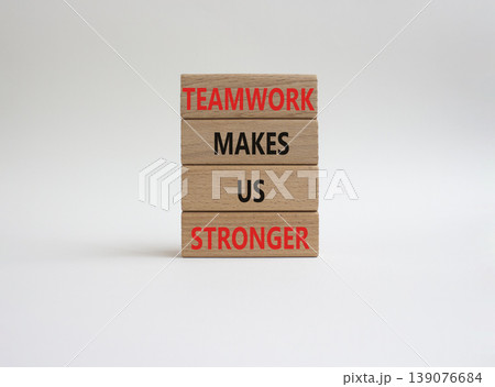 TEAMWORK symbol. Wooden blocks with words TEAMWORK MAKES US STRONGER. Beautiful white background. Business and TEAMWORK concept. Copy space TEAMWORK symbol. Wooden blocks with words TEAMWORK MAKES US STRONGER. Beautiful white background. Business and TEAMWORK concept. Copy space 139076684