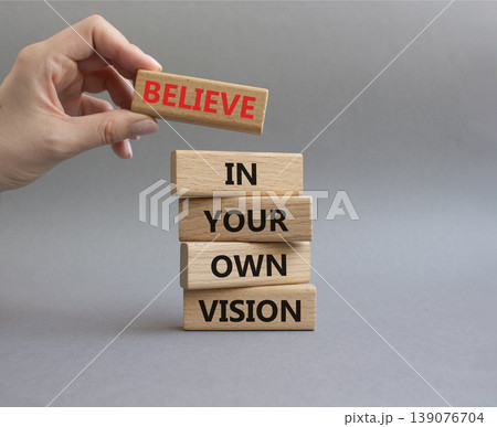 Own Vision symbol. Wooden blocks with words Manage and Believe in Your Own Vision. Businessman hand. Beautiful grey background. Businessman hand. Business and Own Vision concept. Copy space Own Vision symbol. Wooden blocks with words Manage and Believe in Your Own Vision. Businessman hand. Beautiful grey background. Businessman hand. Business and Own Vision concept. Copy space 139076704