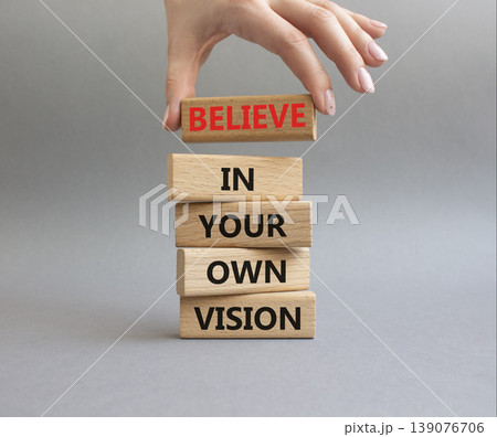 Own Vision symbol. Wooden blocks with words Manage and Believe in Your Own Vision. Businessman hand. Beautiful grey background. Businessman hand. Business and Own Vision concept. Copy space Own Vision symbol. Wooden blocks with words Manage and Believe in Your Own Vision. Businessman hand. Beautiful grey background. Businessman hand. Business and Own Vision concept. Copy space 139076706