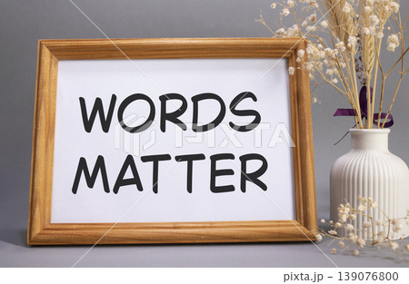 Words Matter symbol. Concept words Words Matter on beautiful wooden picture frame. Beautiful grey background with flower vase. Business and Words Matter concept. Copy space. 139076800