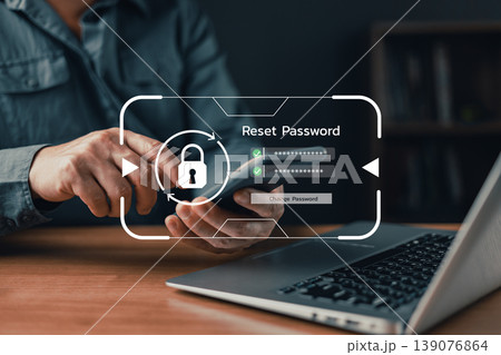 Man using smartphone to reset password with digital security interface, representing cybersecurity, data protection, account recovery, and safe online access concept. Man using smartphone to reset password with digital security interface, representing cybersecurity, data protection, account recovery, and safe online access concept. 139076864
