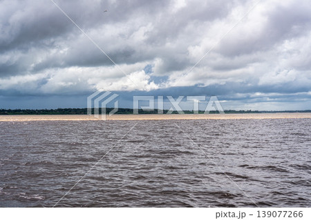 Meeting of the waters of the Negro and Solimoes rivers in the city of Manaus in Amazonia, Brazil Meeting of the waters of the Negro and Solimoes rivers in the city of Manaus in Amazonia, Brazil 139077266