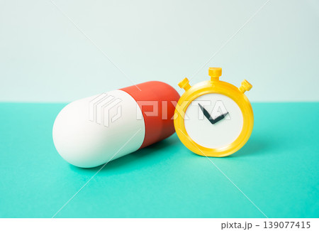 Medicine capsule tablet and stopwatch. Medicine expiration date and shelf life define safety and timing. Sustained therapeutic effect and dosage control support treatment planning and patient care. 139077415