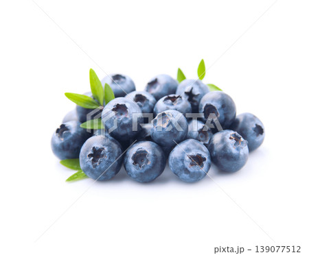 Blueberries with leaves on white Blueberries with leaves on white 139077512