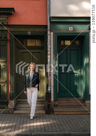Stylish Woman Standing Between Colorful Doorways 139077516