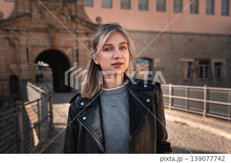 Portrait of Stylish Woman Near Historic City Gate in Europe Portrait of Stylish Woman Near Historic City Gate in Europe 139077742