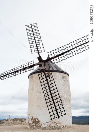 White windmill with wooden blades. Consuegra, Spain 139078278