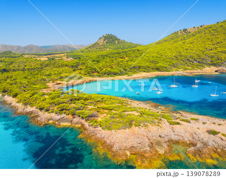 Aerial view of scenic Mallorca beach and turquoise bay with boats in Spain. Aerial view of scenic Mallorca beach and turquoise bay with boats in Spain. 139078289