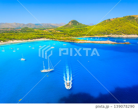 Aerial view of scenic Mallorca beach and turquoise bay with boats in Spain. Aerial view of scenic Mallorca beach and turquoise bay with boats in Spain. 139078290