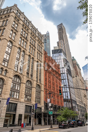 New york, usa august 15,2024. Manhattan streetscape featuring a blend of historic and modern towering buildings, showcasing diverse architectural styles under a cloudy sky New york, usa august 15,2024. Manhattan streetscape featuring a blend of historic and modern towering buildings, showcasing diverse architectural styles under a cloudy sky 139078810