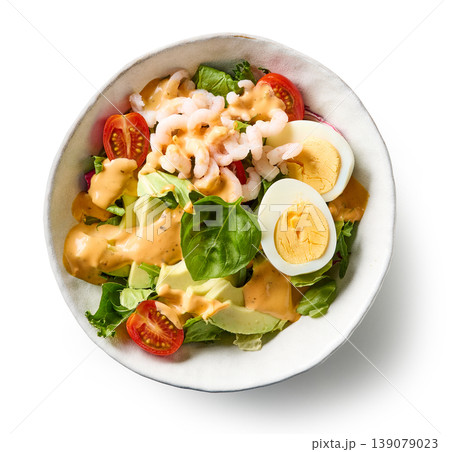 Healthy shrimp avocado salad bowl with egg and dressing isolated on white background Healthy shrimp avocado salad bowl with egg and dressing isolated on white background 139079023
