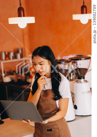 Young woman at barista school learning how to make espresso coffee. Young woman at barista school learning how to make espresso coffee. 139082789