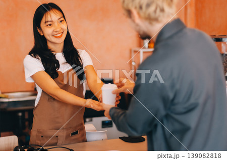 Young woman at barista school learning how to make espresso coffee. Young woman at barista school learning how to make espresso coffee. 139082818
