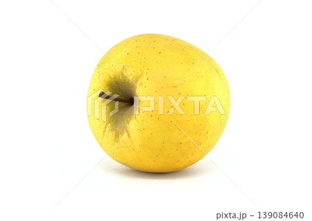 Single golden delicious apple with stem on a clean white background studio shot 139084640