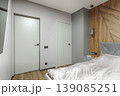 Closed Bifold Door in Modern Grey Bedroom Interior 139085251
