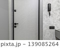 Modern Apartment Security Door with Intercom and Textured Wall 139085264