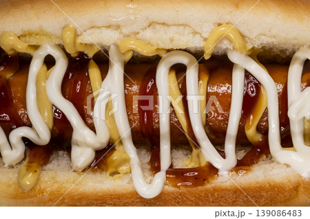 Tasty hot dog with ketchup mayonnaise and mustard 139086483