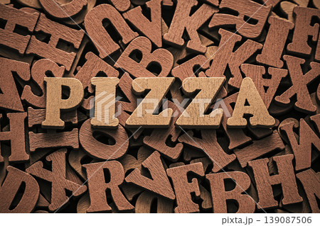 Inscription pizza on pile of old vintage wooden letters. Inscription pizza on pile of old vintage wooden letters. 139087506