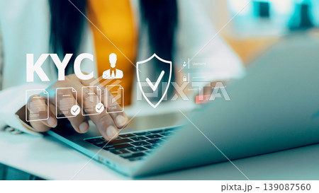 KYC know your customer identity verification process,Digital security and online authentication for banking,Financial compliance and identity protection technology,Verifying documents on laptop screen KYC know your customer identity verification process,Digital security and online authentication for banking,Financial compliance and identity protection technology,Verifying documents on laptop screen 139087560