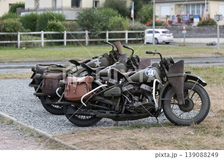 Vintage motorcycles parked outdoors on gravel showing classic design and retro transportation vehicles 139088249