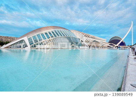 VALENCIA, SPAIN - OCTOBER 17, 2021: Panoramic view of the city of arts and sciences in Valencia created by architect Santiago Calatrava, overlooking Hemisferic and Agora VALENCIA, SPAIN - OCTOBER 17, 2021: Panoramic view of the city of arts and sciences in Valencia created by architect Santiago Calatrava, overlooking Hemisferic and Agora 139089549
