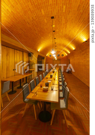 Long dining table in vaulted brick cellar restaurant, Havraniky 139089938